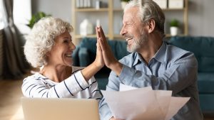 Image of a senior couple high fiving