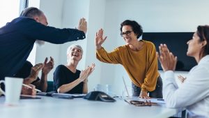 Image of businesspeople high fiving