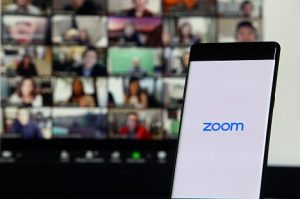 Image of smartphone showing Zoom Cloud Meetings app