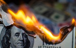 Image of a burning hundred-dollar bill