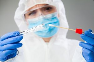 Image of a medical technologist holding a swab