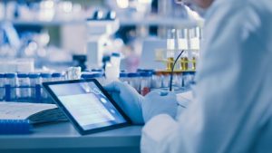 Image of a scientist using a tablet in a laboratory