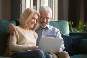 Image of a retired couple on the computer