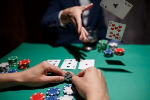 Image of person folding while playing poker