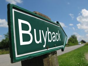 Image of signpost reading "buyback"