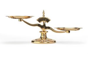 Image of golden balance scales signifying payout ratio