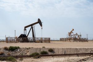 Image of oil pumpjacks in a desert