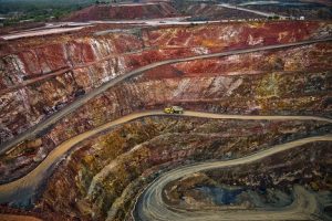 Image of a dump truck driving in an open cast mine