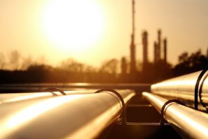 Image of pipes leading from a crude oil refinery