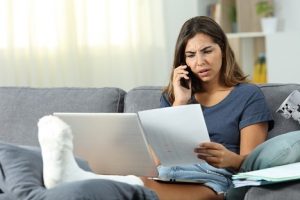 Image of a woman disputing a medical bill over the phone