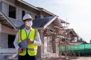 Image of an architect in front of construction