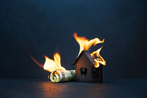 Money and a House Burning