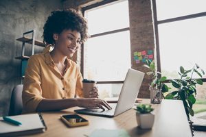 Image of an excited investor on a laptop