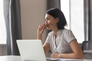 Image of reflecting businesswoman