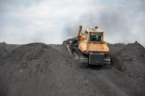 Image of caterpillar tractor collecting coal