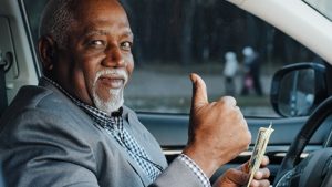 Image of an older man counting cash