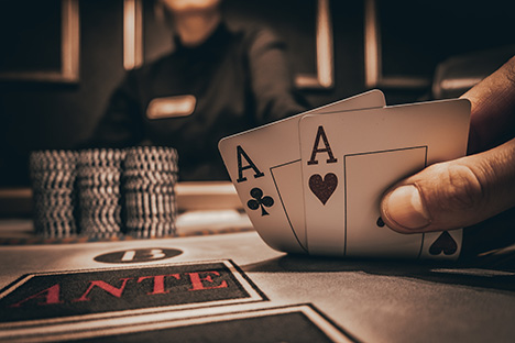 Player showing a hand with two aces