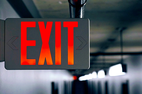 Image of an Exit sign with red lettering