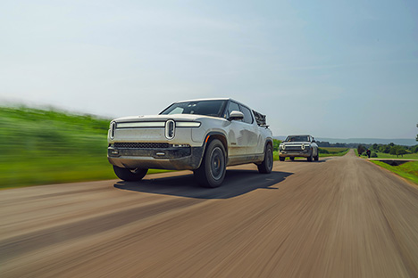 Image of a Rivian pickup truck in motion