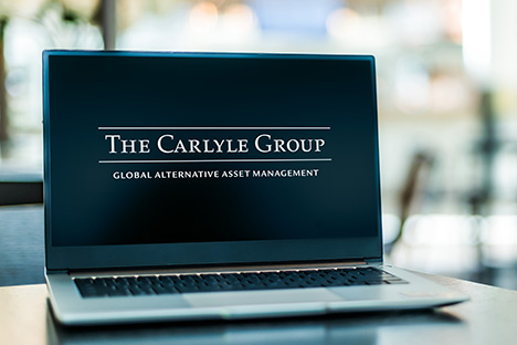 Image of the Carlyle Group logo on a laptop