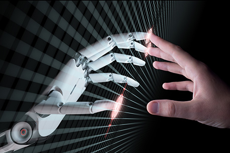 Image of hands of artificial intelligence robot and human touching
