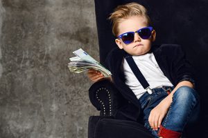 Kid holding cash