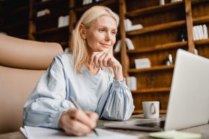 A woman sitting at her computer