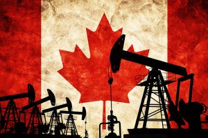 an oil pump in front of the Canadian flag