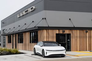 A Lucid Group car parked in front of a building