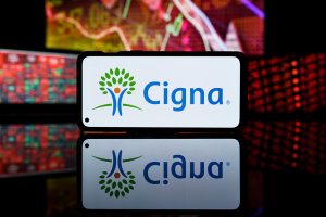 a smartphone showing the logo of The Cigna Group