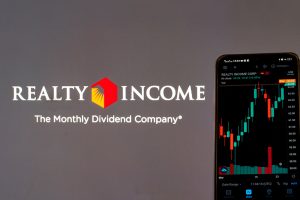 The Realty Income logo with “The Monthly Dividend Company” written below it