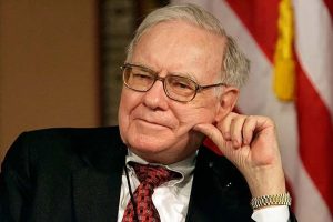 Warren Buffett making a pensive expression