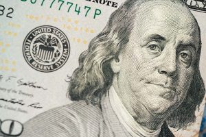 A close-up of Benjamin Franklin’s face on a U.S. dollar bill