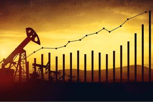 An oil pump behind a depiction of a rising stock chart