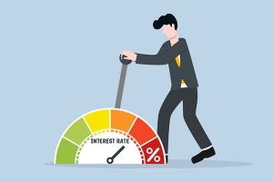 A graphic of a man pulling an “interest rate” lever