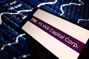 A phone screen showing the logo of FS KKR Capital Corporation