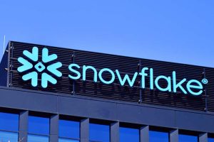 The logo for Snowflake on the side of a building