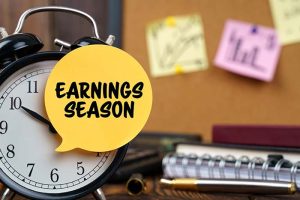 An alarm clock with the phrase “earnings season” in front of it