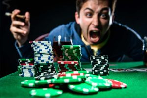 A poker player looking at his chips and screaming