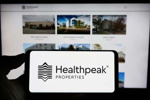 A smartphone showing the logo for Healthpeak Properties