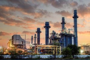 A power plant photographed at sunset