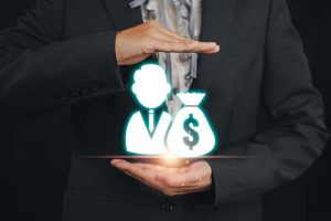 A businessman in a suit holding icons that represent private equity and investment