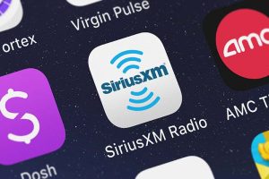 The logo for the SiriusXM app on a smartphone