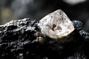 A shining diamond lying on a rock