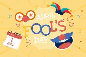 The words “APRIL FOOL’S DAY” surrounded by a calendar turned to April 1, a jester cap, and other items related to the holiday