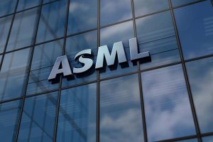 The logo for ASML Holding on the side of a glass building