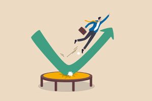 A declining stock chart bouncing up off a trampoline, with a businessman jumping alongside it