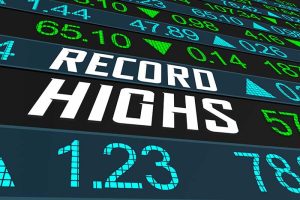 Several rows of stock prices surrounding the words “RECORD HIGHS”