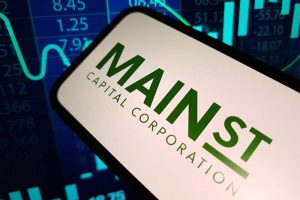 A smartphone showing the Main Street Capital logo, with a blue stock chart in the background