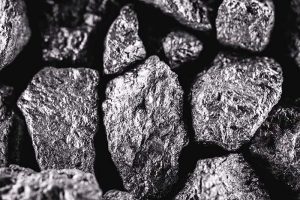 A close-up view of a few pieces of scandium, a rare earth element